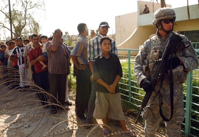 U.S. and Iraqi army doctors and medics provide medical care in Baghdad neighborhood.