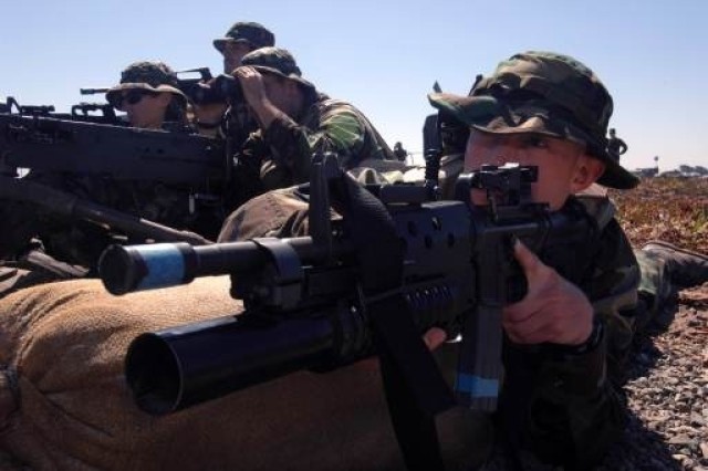 M203