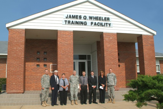 Sons of the late James Q. Wheeler join Gen Benjamin Griffin, Commanding General, Army Materiel Command in unveiling a plaque that will be displayed on the front of the James Q. Wheeler Training Facility. Pictured are from left, John Wheeler,...