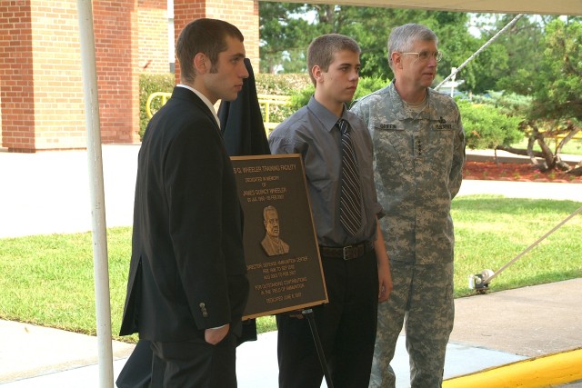 The Wheeler family and official party stand in front of the newly dedicated James. Q. Wheeler Training Facility. Pictured are from left, Col Gary Carney, McAlester Army Ammunition Plant Commander, Wayne Wheeler, Linda Wheeler, Gen Benjamin...