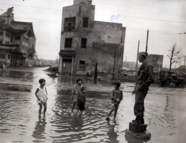 Japanese Children in a Puddle