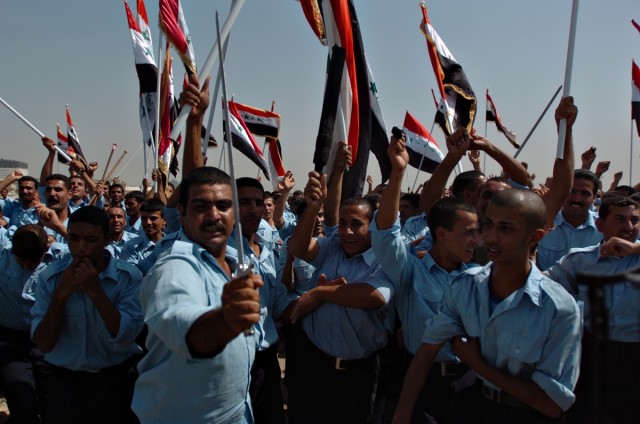 Iraqi Police celebrate their gradation from the Baghdad Police College in the Rusafa District Sept. 20. The first class of its kind graduated 744 IPs of Abu Ghraib from the 30-day course, which provides training before returning the local police offi...