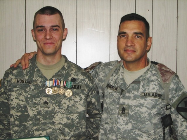 Townsend, Mont., natives, Command Sgt. Maj. Philip Johndrow, the Multi-National Division - Baghdad and 1st Cavalry Division command sergeant major from and Mostad, a Postal Finance Clerk with the 747th Adjutant General Company (Postal) take time...