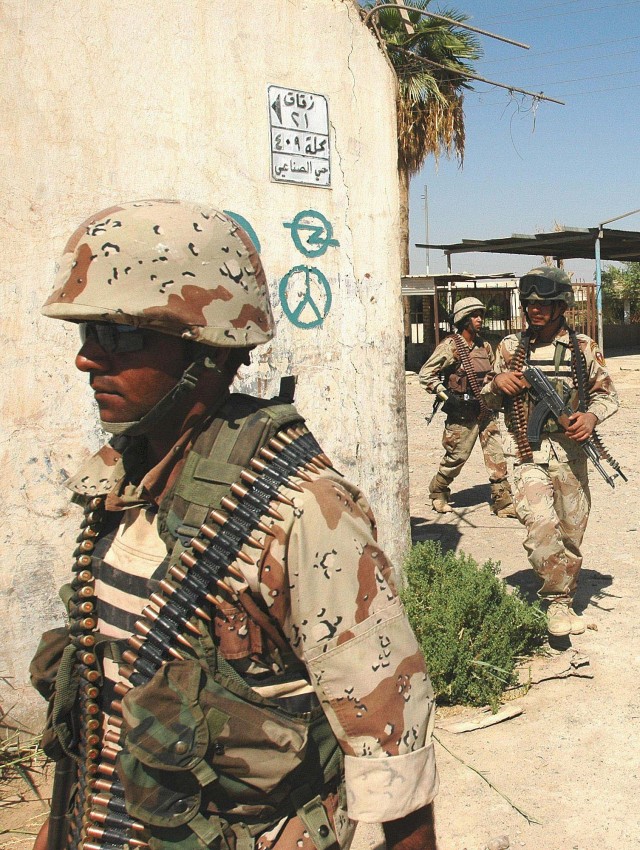 Operation Rock Wrench clears industrial section of Baqouba - An automatic weapons team from the 5th Iraqi Army Division moves through the industrial section of southern Baqouba, Sept. 22.  Iraqi forces focused on clearing structures while U.S....