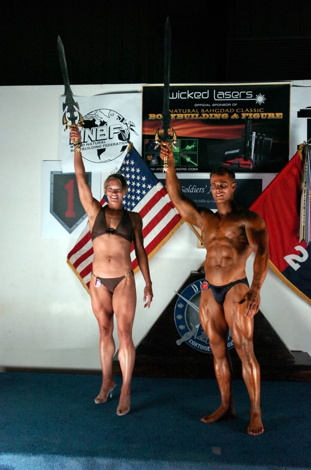 The overall winners of the 2nd Baghdad Classic Bodybuilding and Figure Competition, College Park, Md., native Spc. Allison Schlegel and Staff Sgt. Joseph Fiorani from Eldersburg, Md., both from the 58th Infantry Brigade Combat Team, pose for...