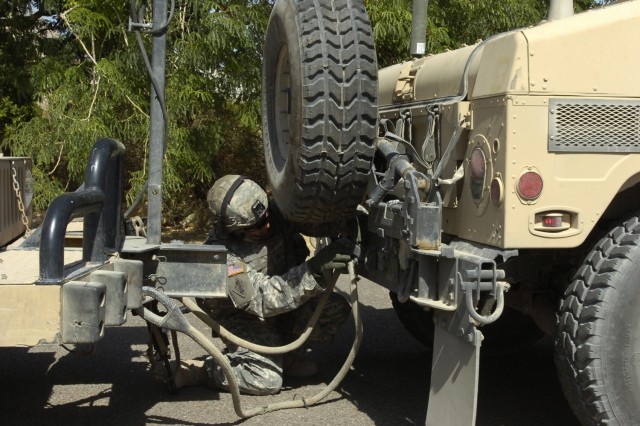 Sgt. Justin Dasilva prepares a disabled humvee to be towed after it was hit by a simulated roadside bomb during a lane training exercise conducted by Soldiers from the 15th Brigade Support Battalion, 2nd Brigade Combat Team, 1st Cavalry Division, in ...