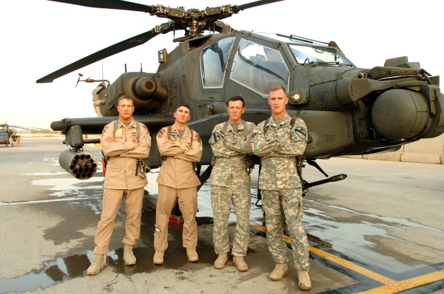 (Left to right) Chief Warrant Officer 3 Terry Eldridge, Capt. Thomas Loux, Chief Warrant Officer 2 Cole Moughon and Chief Warrant Officer 3 Kyle Kittleson pose in front of an AH-64D Apache. The four pilots from 1st "Attack" Battalion, 227th Aviation ...