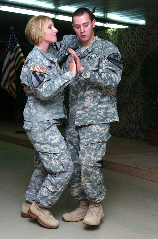 Buffalo, N.Y., native Sgt. Elizabeth Vega (left), a chemical operations specialist for, 1st Air Cavalry Brigade, 1st Cavalry Division, and New Jersey native Sgt. Harvey Olarte (right), a chemical operations specialist, both assigned to Company A, 615...