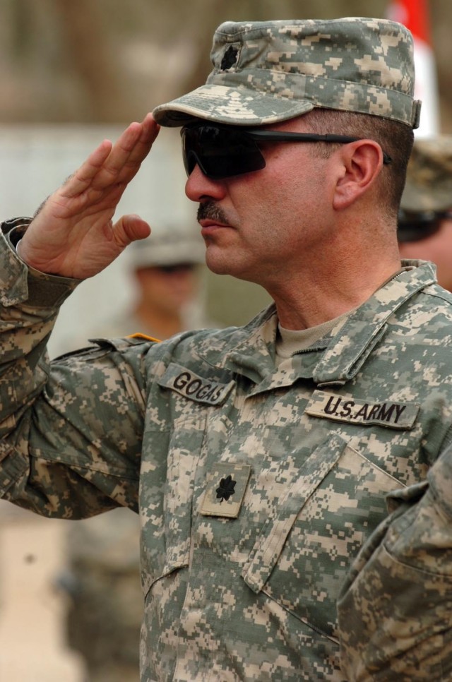Lt. Col. Keith Gogas, commander for 6-9 Armored Reconnaissance Squadron, 3rd Brigade Combat Team, 1st Cavalry Division, renders one last salute to his Soldiers during a memorial ceremony at Forward Operating Base Normandy. The memorial ceremony honor...