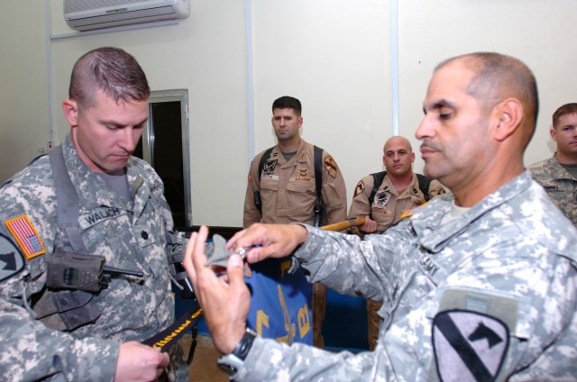 Las Vegas, Nev., native Lt. Col. Christopher Walach (left), commander of the 1st "Attack" Battalion, 227th Aviation Regiment, 1st Air Cavalry Brigade, 1st Cavalry Division, and Bayamon, Puerto Rico, native Command Sgt. Maj. Ismael Medina (right),...