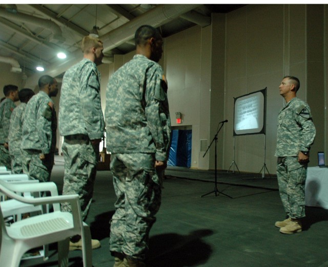 First Sgt. Jimmy Peter, of Headquarters and Headquarters Troop, 3rd Brigade Combat Team, 1st Cavalry Division, calls the final roll call during a memorial service honoring Staff Sgt. Donnie Dixon, a member of the brigade commander's personal security...