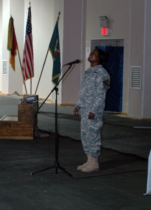 A Soldier with the 3rd Brigade Combat Team, 1st Cavalry Division, sings a song of remembrance during a memorial service for Staff Sgt. Donnie Dixon, a Soldier with Headquarters and Headquarters Troop, at Forward Operating Base Warhorse, Baqouba, Iraq...