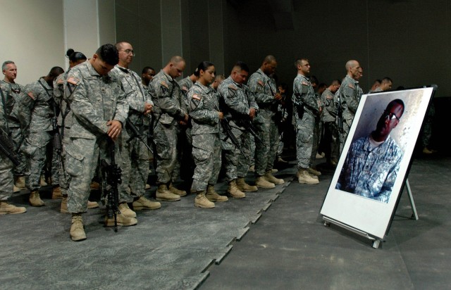 Soldiers of 3rd Brigade Combat Team, 1st Cavalry Division, remember the life and sacrifice of Staff Sgt. Donnie Dixon, a member of Headquarters and Headquarters Troop, during his memorial service at Forward Operating Base Warhorse, Baqouba, Iraq, Oct...