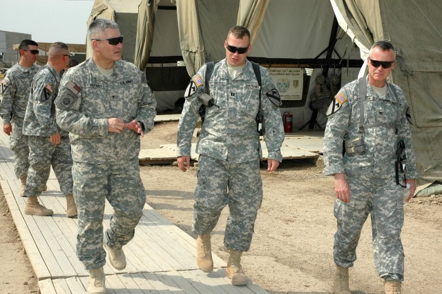 While visiting the 1st Air Cavalry "Warrior" Brigade at Camp Taji, Iraq, Oct. 13, Fairfield, Calif., native Brig. Gen. John Campbell (left), the deputy commanding general for maneuver for the Multi-National Division-Baghdad and 1st Cavalry Division, ...