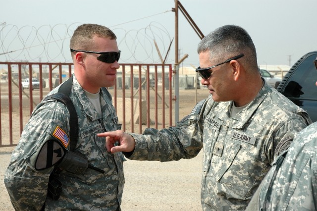 Fairfield, Calif., native Brig. Gen. John Campbell (right), the deputy commanding general for maneuver for the Multi-National Division-Baghdad and 1st Cavalry Division, tries to pronounce the name of Salem, Ore., native Capt. Marlow...