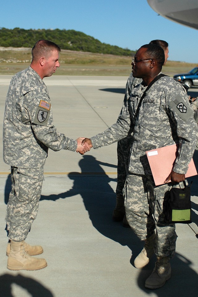 Sergeant Major of the Army Kenneth Preston, a native of Mount Savage, Md., and the Army's senior noncommissioned officer, welcomes home Charleston, S.C., native Sgt. 1st Class Carl Steed, the senior food service noncommissioned officer for the 15th S...