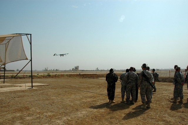 A crowd looks on as they watch the first-ever launch of an unmanned aerial vehicle by an Iraqi. Iraqi Army Lt. Gen. Abud Qanbar, the commanding general of Baghdad Operational Command, launched the Shadow UAV during his visit with the leaders of...
