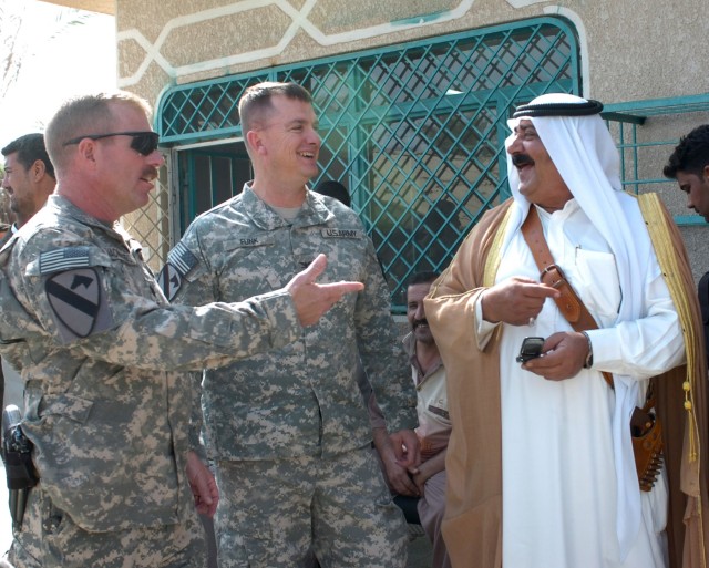 Lt. Col. Kevin MacWatters (left), commander, 1st Squadron 7th Cavalry Regiment, Col. Paul E. Funk II (center), commander, 1st Brigade Combat Team, 1st Cavalry Division and a local area tribal sheik discuss their common goals for reconciliation at...
