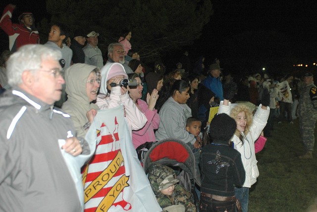 Family members wait to meet their Soldiers on Fort Hood's Cooper Field Oct. 22 during a welcome home ceremony for members of the 1st Cavalry Division, the 3rd Signal Brigade and the Army Reserve's 952nd Engineer Company. Approximately 300 troops,...