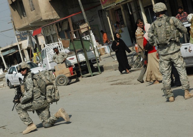 Soldiers from 1-12 Combined Arms Battalion, 3rd Brigade Combat Team, 1st Cavalry Division, patrol the Old Baqouba market in Baqouba, Iraq, Oct. 21. Prior to Operations Arrowhead Ripper and Lighting Hammer, the city was virtually shut down due to wide...