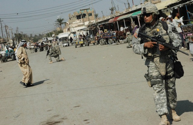 Spc. Jaime Martinez, a medic with the 3rd Brigade Combat Team, 1st Cavalry Division commander's personal security detachment, conducts a patrol through the Old Baqouba market in Baqouba, Iraq, Oct. 21. Prior to Operations Arrowhead Ripper and Lightin...