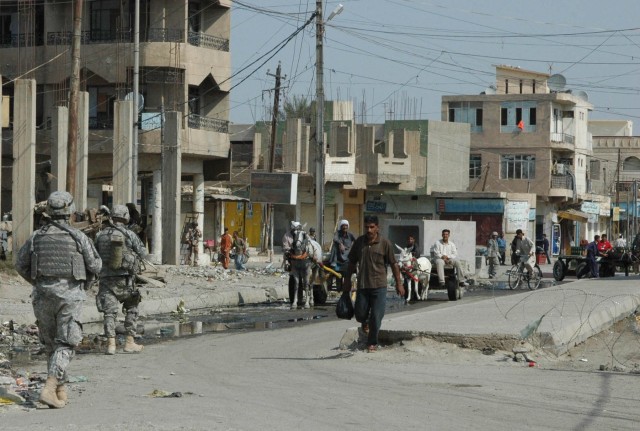 Soldiers from 1-12 Combined Arms Battalion, 3rd Brigade Combat Team, 1st Cavalry Division, patrol the Old Baqouba market in Baqouba, Iraq, Oct. 21. Prior to Operations Arrowhead Ripper and Lighting Hammer, the city was virtually shut down due to wide...