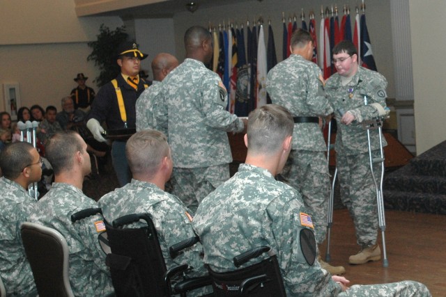 Spc. Robert Stephenson, of 3rd Battalion, 509th Infantry Regiment, 25th Infantry Division, was the first wounded warrior to have their Purple Heart Medal pinned to their lapel by Brig. Gen. Frederick S. Rudesheim, III Corps and Fort Hood...