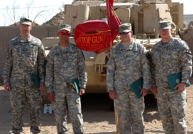 After being named "Top Gun" and receiving Army Achievement Medals, a "Top Gun" muzzle cover for their howitzer and a "Top Gun" streamer for their battery guidon, a Paladin M109A6 howitzer crew, all Soldiers from 2nd Platoon, Battery A, 1st...