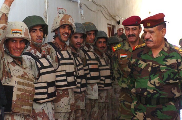 Iraqi Army Lt. Gen. Abud Qanbar (right), commanding general of the Baghdad Operations Command addresses Iraqi Army troops from the 3rd Brigade, 9th Iraqi Army Division (Mechanized) on the success of their efforts in increasing security near Al...