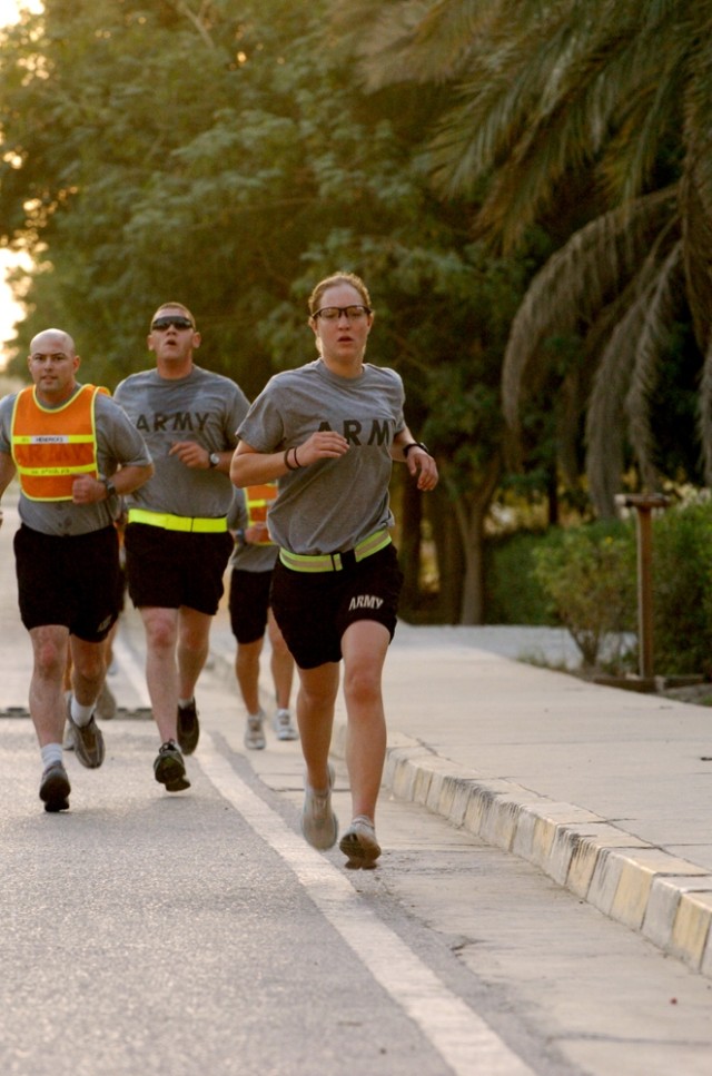 Sgt. Elizabeth Carroll, a member of the 1470th Tactical Psychological Operations Detachment of Denver, makes a dash toward the finish line during the Prosperity Run Club's Breast Cancer Awareness run on Forward Operating Base Prosperity in central...
