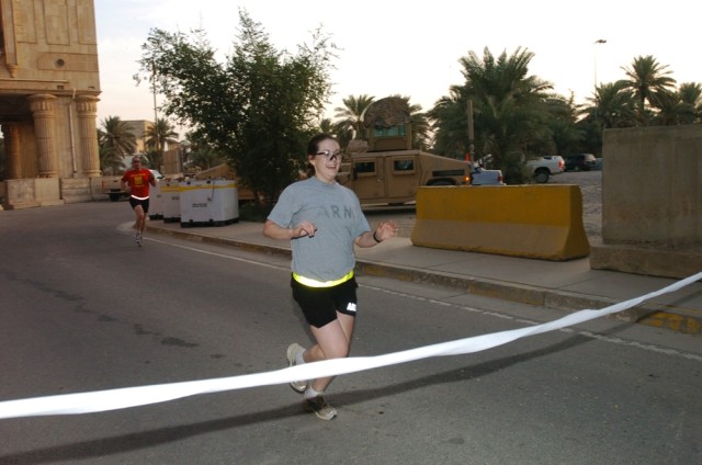 Klamath Falls, Ore., native 1st Lt. Marci Hanson, of Company B, 2nd Brigade Special Troops Battalion, was the first overall female finisher with a time of 21:30 during the Prosperity Run Club's Breast Cancer Awareness run on Forward Operating Base...