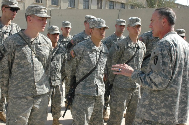 Maj. Gen. David H. Huntoon Jr., commandant of the U.S. Army War College in Carlisle, Penn., thanks the Soldiers of his son's platoon, Company B, 1st Battalion, 38th Infantry Regiment, 4th Stryker Brigade Combat Team, 2nd Infantry Division, before...