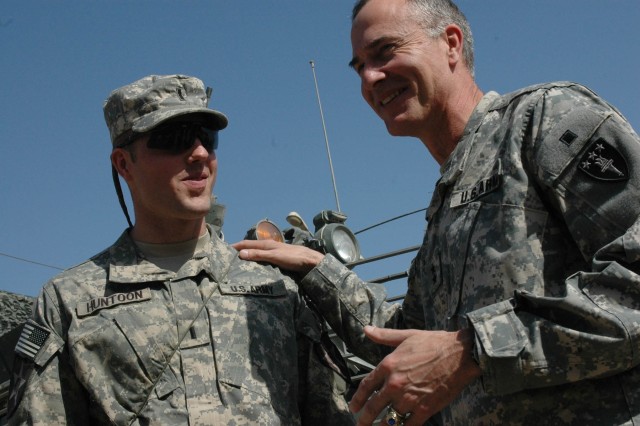 For their first visit since February, Maj. Gen. David H. Huntoon Jr., commandant for the U.S. Army War College, spends time with his son, newly-promoted Capt. David H. Huntoon III, a Soldier with 1st Battalion, 38th Infantry Regiment, 4th Stryker...