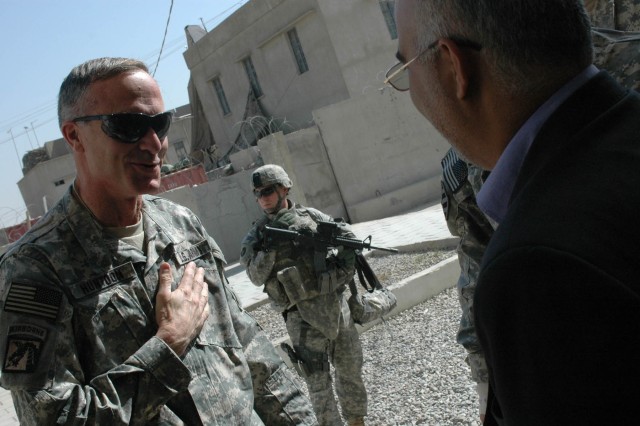 Maj. Gen. David H. Huntoon Jr., commandant of the U.S. Army War College in Carlisle, Penn., greets Dr. Hussein al-Zubaidi, provincial council member in charge of security, upon his visit to the Diyala Operations Center in Baqouba, Iraq, Nov. 2....