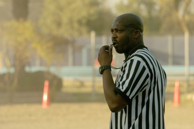 Shreveport, La., native Staff Sgt. Jessie Jackson Jr., Headquarters and Headquarters Troop, 4th Squadron, 9th Cavalry Regiment, 2nd Brigade Combat Team, 1st Cavalry Division of Shreveport, La., officiates a flag football game at Forward Operating Bas...