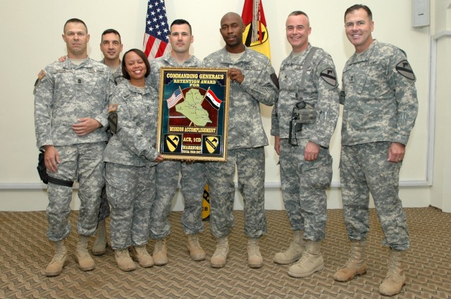 The brigade career counselors for the 1st Air Cavalry "Warrior" Brigade, 1st Cavalry Division, along with their commander and sergeant major, stop to pose with Maj. Gen. Joseph F. Fil Jr. (far right), the commanding general of the 1st Cav. Div. and M...