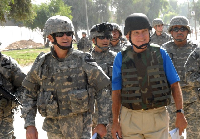 Maj. Gen. Joseph Fil Jr., commanding general of the Multi-National Division - Baghdad and 1st Cavalry Division, walks beside Maj. Gen. (Ret.) Robert H. Scales Jr., a senior analyst for Fox News, during a tour of the Abu Nuwas area of eastern Baghdad ...