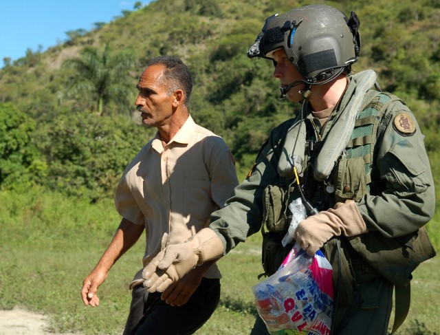 Soldiers Deliver Food, Medicine After Tropical Storm Noel