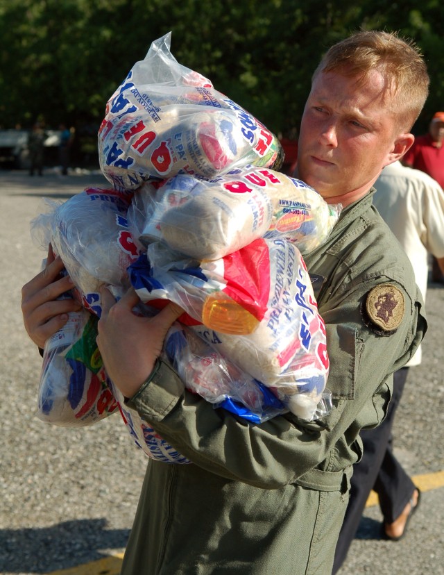 Soldiers Deliver Food, Medicine After Tropical Storm Noel