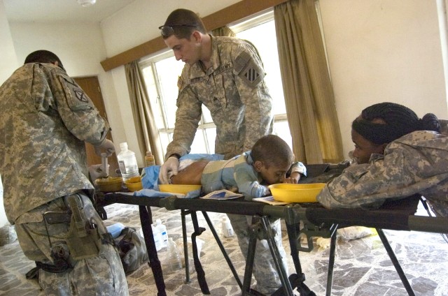 Soldiers Provide Medical Assistance