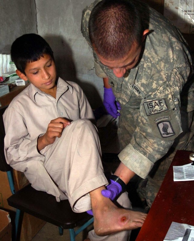 Soldiers Provide Medical Assistance