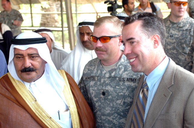 A local tribal leader; Lt. Col. Kevin MacWatters, commander, 1st Squadron, 7th Cavalry Regiment, 1st Brigade Combat Team, 1st Cavalry Division and Brian Conklin, a Baghdad 5 Embedded Provincial Reconstruction Team representative, converse on the...