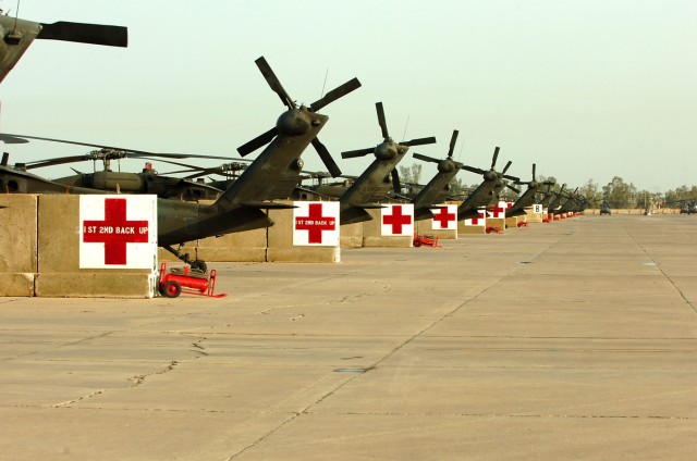 Medical evacuation UH-60 Black Hawk helicopters sit on the airfield at Camp Taji, Iraq. The MEDEVAC Soldiers from Company C, 2nd Battalion, 227th Aviation Regiment, 1st Air Cavalry Brigade, 1st Cavalry Division, transferred authority of the MEDEVAC m...