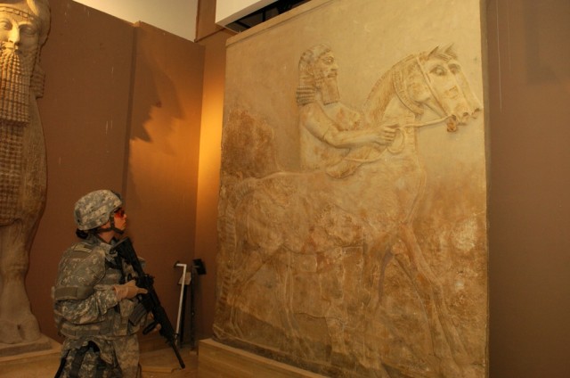 Rialto, Calif., native Sgt. Cynthia White, a medic assigned to the 2nd Brigade Special Troops Battalion, 2nd Brigade Combat Team, 1st Cavalry Division, looks at an ancient relief sculpture during a tour of exhibits inside the Iraqi National Museum in...