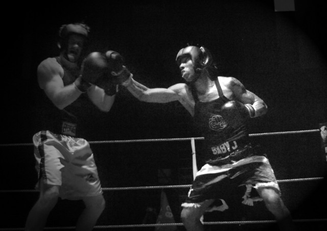 Camden, N.J., native Sgt. Chris Thomas (right) plugs his opponent with a right hand during a boxing smoker earlier this year.  He would go undefeated and win the lightweight title. More recently, Thomas won the 2nd "Black Jack" Brigade Combat...
