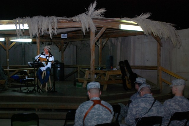 Salado, Texas native, Freddie Fuller sings for Soldiers at the Pegasus Dining Facility at Camp Liberty in western Baghdad, Nov. 12. Fuller, who calls himself the "Singing Cowboy," performed the last of his seven-concert tour outside the 1st Cavalry D...