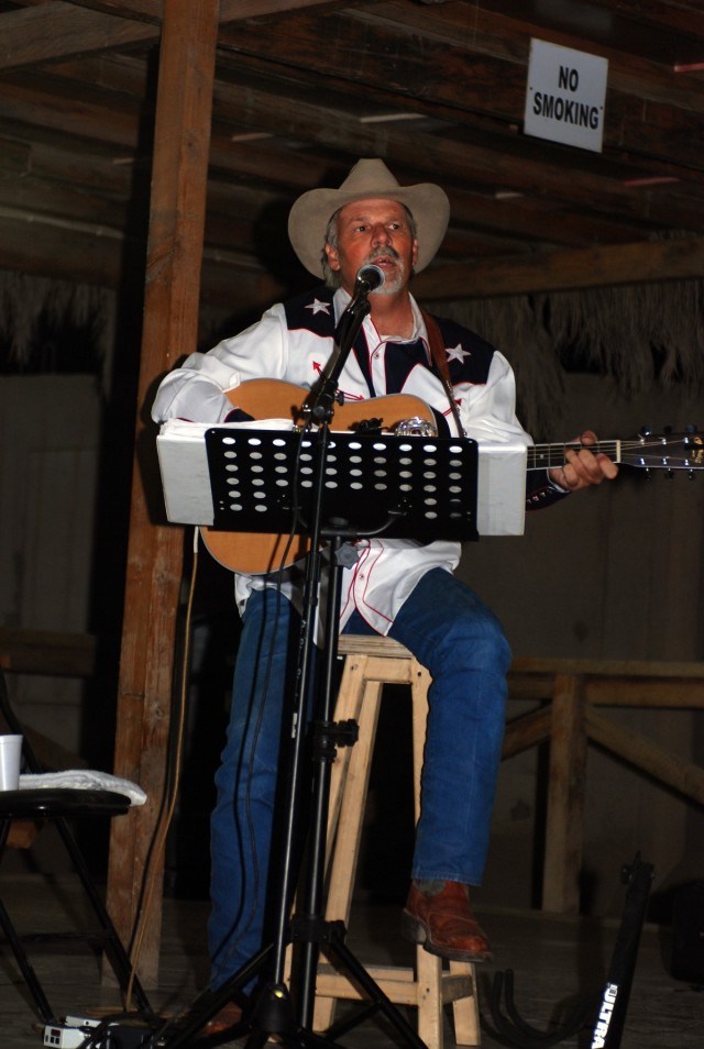 Freddie Fuller, the "Singing Cowboy," performs for Soldiers at the Pegasus Dining Facility at Camp Liberty in western Baghdad, Nov. 12. Fuller, a Salado, Texas native made a seven-day visit to Iraq performing for 1st Cavalry Division Soldiers through...