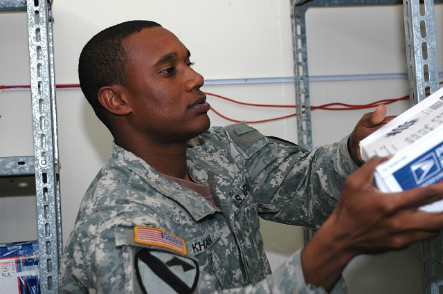 Spc. Renaldo Khan, 615th Aviation Support "Cold Steel" Battalion, sorts packages in the 1st Air Cavalry Brigade mailroom Nov. 16 at Camp Taji, Iraq. Khan, a utilities equipment repairer, worked in the brigade mailroom throughout his deployment,...