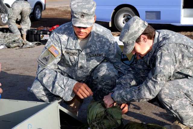 Olathe, Colo., native Staff Sgt. Raymond Martinez and Springfield, Ill., native Staff Sgt. Christine Cooper, both operations noncommissioned officers with Headquarters Support Company, Special Troops Battalion, 1st Cavalry Division, inventory their C...