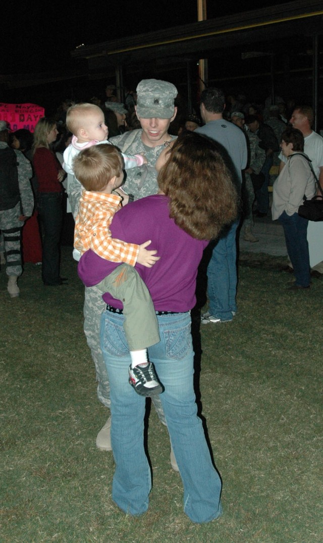 Lawrenceburg, Ky, native Sgt. Russell Neal, an apache mechanic with 4th Battalion, 227th Aviation Regiment, 1st Air Cavalry Brigade, 1st Cavalry Division, reunites with his family at a homecoming ceremony on Cooper Field at Fort Hood, Texas,...